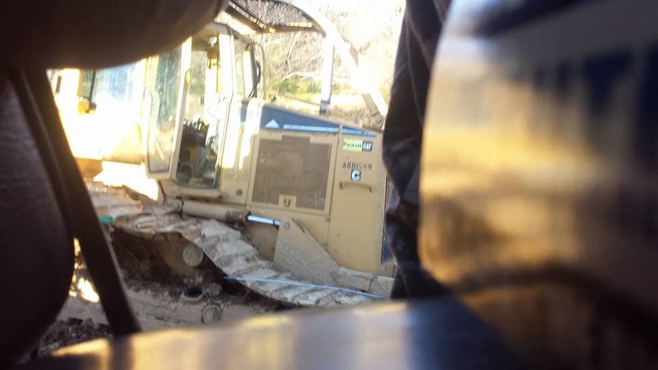 Close-up of a CAT bulldozer engine compartment during equipment service
