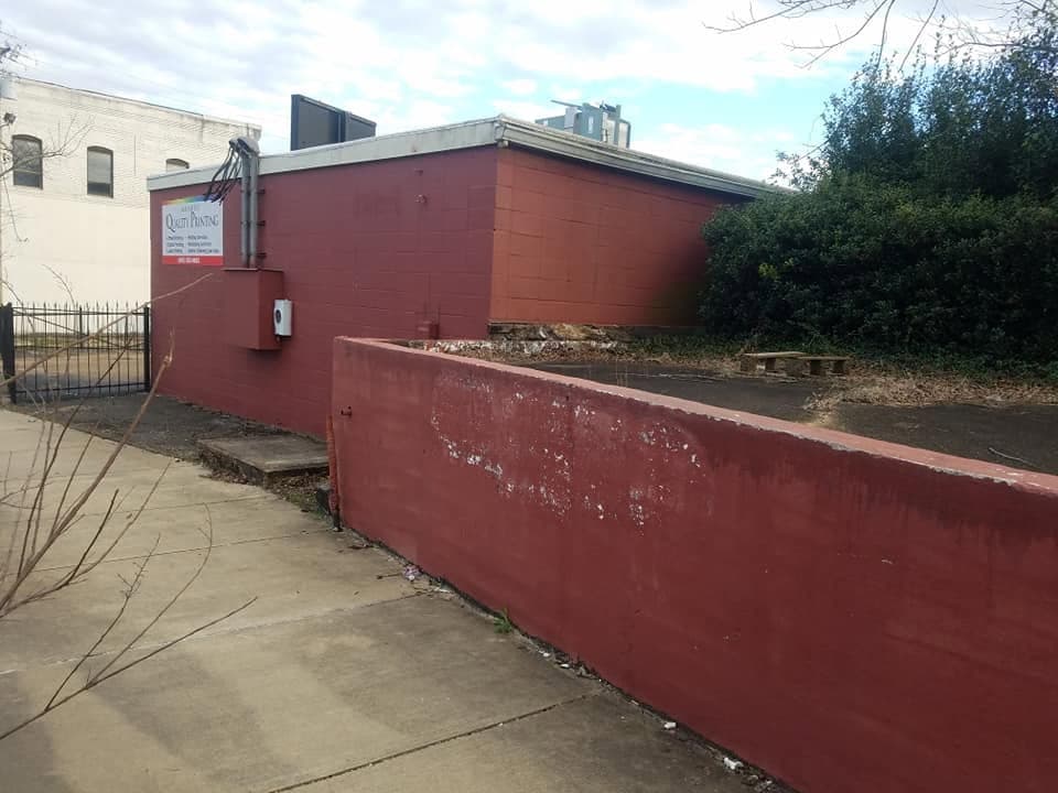 Commercial building exterior adjacent to a Nichols and Sons Construction project site