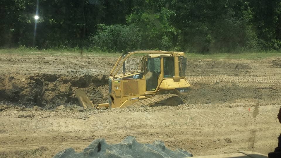 CAT bulldozer cutting a grade bank on a Canton, Mississippi excavation site